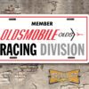 Member Oldsmobile Racing Division Booster Aluminum License Plate White Yellow