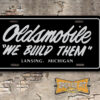 Oldsmobile "We Build Them" License Plate