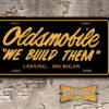 Oldsmobile "We Build Them" License Plate