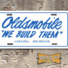 Oldsmobile "We Build Them" License Plate