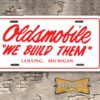 Oldsmobile "We Build Them" License Plate