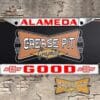 A vintage style reproduction Good Chevrolet license plate frame from the defunct dealership of Alameda, California . This reproduction dealership license plate frame will look great bolted on to your Classic Chevy whether it’s a Cruiser, a Hot Rod or a Muscle Car.