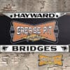 A vintage style reproduction dealership license plate frame for the Bridges Pontiac dealership of Hayward, California. This reproduction dealership license plate frame will look great bolted on to your Classic Pontiac whether it's a Cruiser, a Hot Rod or a Muscle Car.